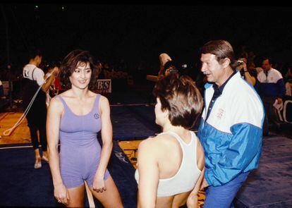 Former Olympic athlete Nadia Comaneci talks to Bela Karolyi, her coach since the age of 6; January 1, 1991.