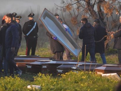 Employees of the local funeral home prepare coffins for the bodies of the migrants killed in the shipwreck in Calabria.