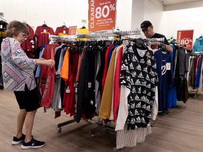 Shoppers browse through clothing racks in a Maryland (USA) store.