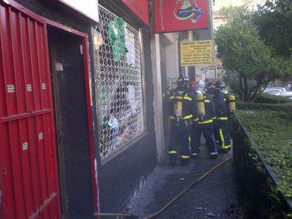 Firefighters at the scene after the explosion in the store known locally as Ca&ntilde;am&aacute;n.