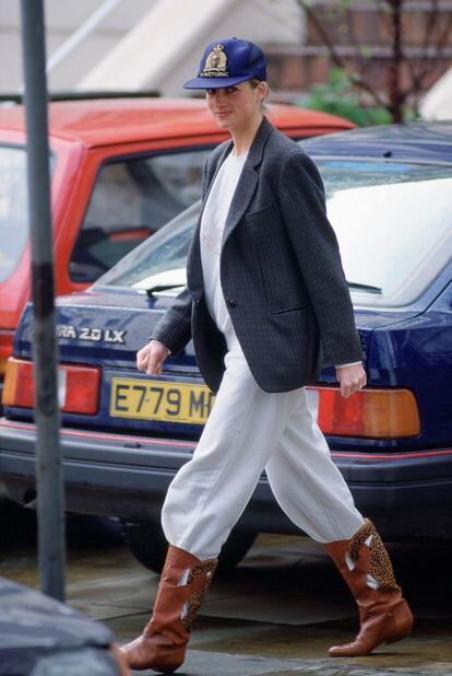 Princess Diana of Wales sporting a baseball cap on the streets of London; 1989.

