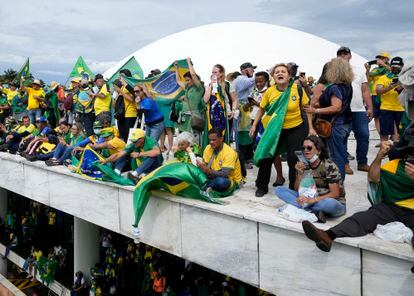 Jair Bolsonaro supporters on the roof of the National Congress building on January 8, 2023.