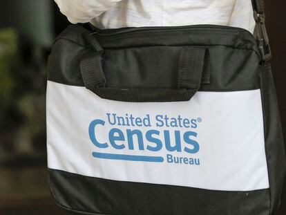 A briefcase of a census taker is seen as she knocks on the door of a residence, Aug. 11, 2020, in Winter Park, Florida.