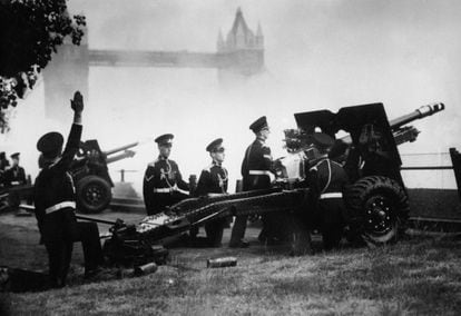 'A' Battery of the Honourable Artillery Company, wearing their ceremonial uniforms, fire a 62-gun salute from the Tower of London in celebration of the Queen's coronation. 