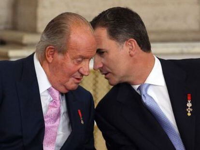 Former King Juan Carlos and his son King Felipe VI.