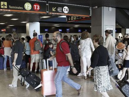 Travelers at Madrid’s Barajas airport.