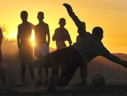 Children playing soccer in South Africa.