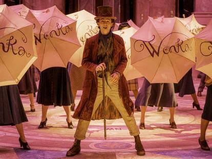This image released by Warner Bros. Pictures shows Timothee Chalamet, center, in a scene from "Wonka."
