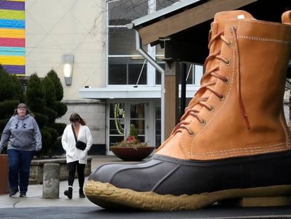 Shoppers pass an large L.L. Bean boot displayed outside an L.L. Bean store in Pittsburgh on Monday, Jan. 30, 2023.
