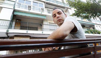 Ernesto Soriano in front of the property in which he lives with his grandmother.