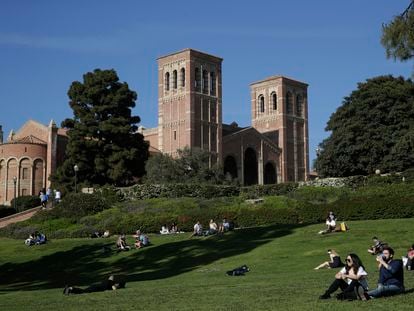 Students sit on the lawn near Royce Hall at UCLA in the Westwood section of Los Angeles on April 25, 2019.