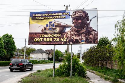 A sign inviting to join the Ukrainian army, on the entrance road to Kupiansk, on May 10.