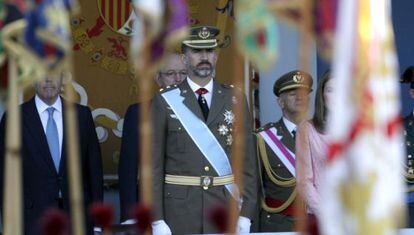 Prince Felipe stands as soldiers pass by during the October 12 parade in Madrid.