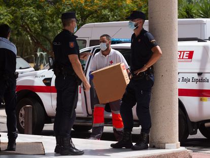 A member of the Red Cross brings medical supplies to an emergency center in Málaga, where a coronavirus outbreak has been detected.
