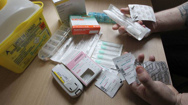 A man shows the opioid drugs he uses.