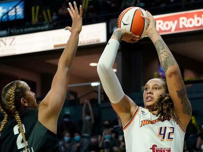 Phoenix Mercury's Brittney Griner (42) shoots over Seattle Storm's Mercedes Russell in the first half of the second round of the WNBA basketball playoffs Sunday, Sept. 26, 2021, in Everett, Wash.