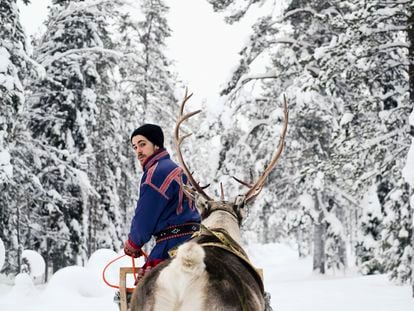 A Sámi reindeer herder in Lapland, Finland in February 2018.