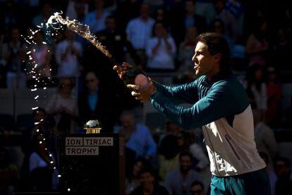Rafa Nadal celebrates his Madrid Masters triumph with cava after defeating Stanislas Wawrinka in the final.