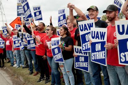 Striking United Auto Workers (UAW) members from the General Motors Lansing Delta Plant