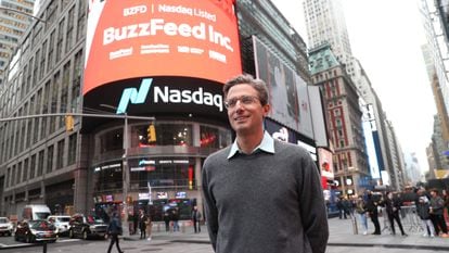 CEO of BuzzFeed Jonah H. Peretti poses in front of BuzzFeed screen on Times Square