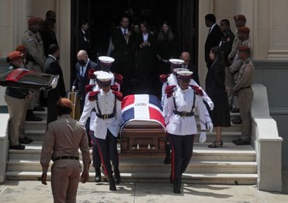 The coffin of Orlando Jorge Mera is taken out of the National Palace chapel following a Mass in his honor.
