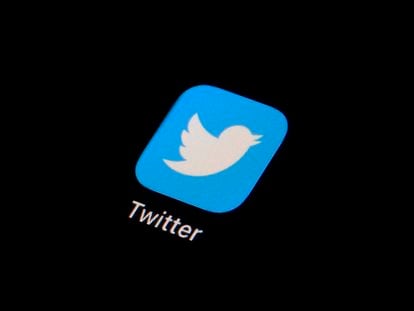 The Twitter app icon is displayed on a smartphone, Feb. 28, 2023.