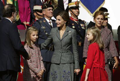 Queen Letizia, Infanta Leonor and Infanta Sofia with Spanish Prime Minister Mariano Rajoy (far left) during the parade.