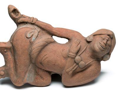 Maya ceramic sculpture found in Guatemala depicting an enema ritual.