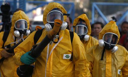 Rio health workers on Tuesday fumigate the Sambódromo, where Carnival celebrations will be held.