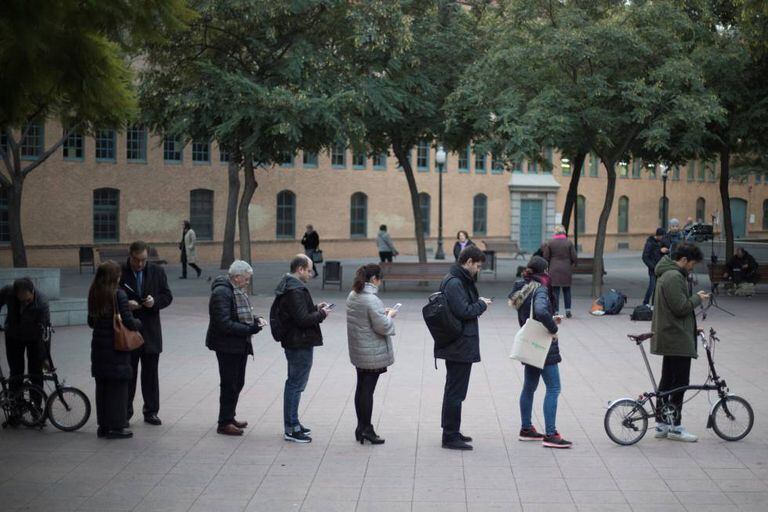 Barcelona voters wait in line to cast their vote in the Catalan election.