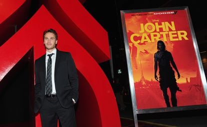 Actor Taylor Kitsch posing for the media at the premiere of 'John Carter' in L.A. on February 22, 2012.