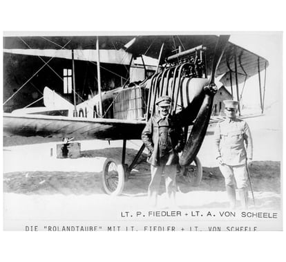 Von Scheele (right) in Namibia, next to one of the German colonial air force planes. 