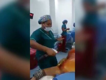 Surgery room personnel dancing around a sedated patient in Colombia.