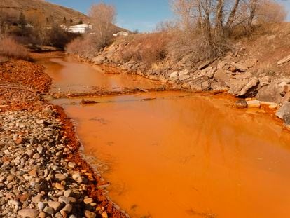 This photo provided by the Montana Department of Environmental Quality shows acid mine drainage in polluted Belt Creek in Montana, on March 7, 2016.