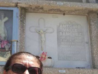 Juana Escudero Lezcano beside the tomb of her namesake.