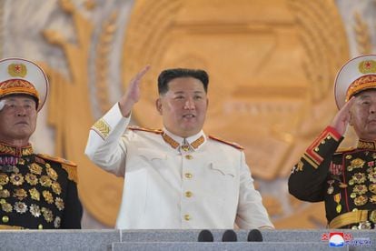 North Korea's Supreme Leader Kim Jong-un in a marshal's uniform salutes during Sunday's military parade