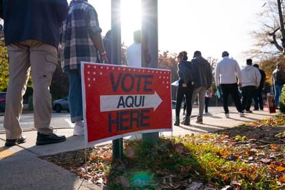 Voters stand in line at an early voting center in Woodbridge, Virginia. 