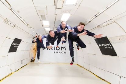 Michael López-Alegría, second left, in zero-gravity flight aboard an Axiom Space aircraft with his fellow mission members.