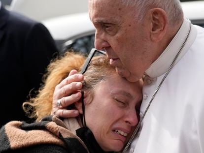 Pope Francis consoles a woman who lost her five-year-old daughter, as he leaves the Agostino Gemelli University Hospital in Rome on Saturday.