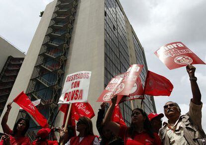 Hundreds of employees of the state oil company PDVSA protest in Caracas against US sanctions.