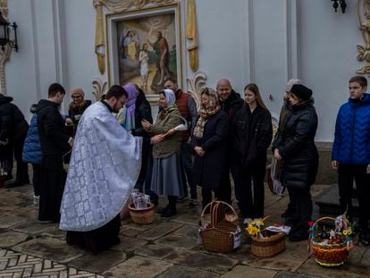 Orthodox Christian worshipers and their traditional Easter baskets are blessed during Easter Sunday at the Pechersk Lavra monastic complex in Kyiv, Sunday, April 16, 2023.