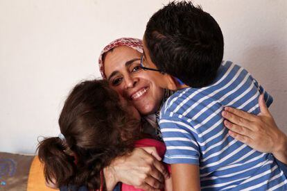 Houssnia el Khadiri with her children Fouad and Fadwa at home in Quijorna, Madrid.
