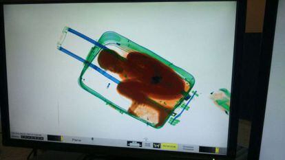 A security scanner image of eight-year-old Abou inside the suitcase.