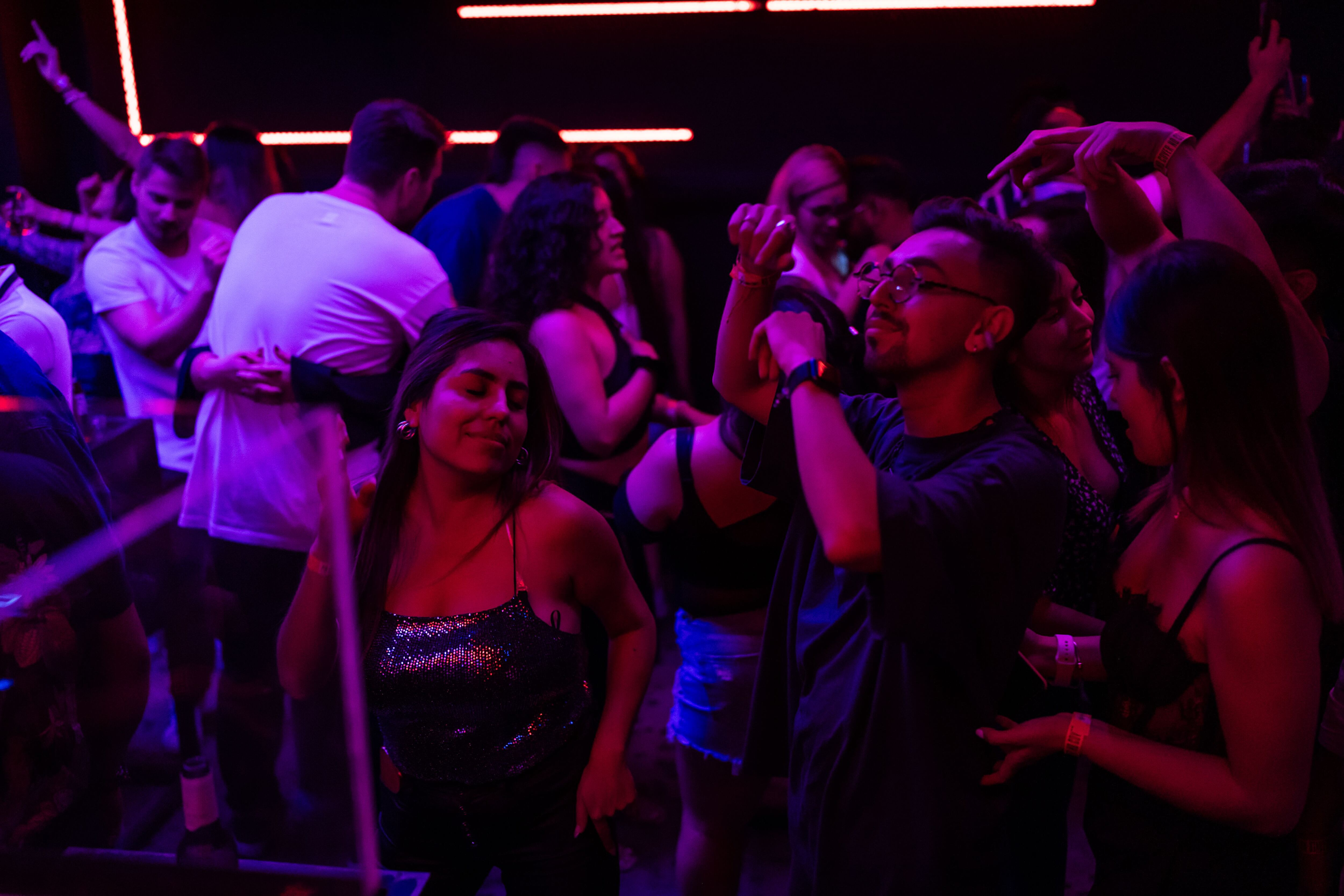 People dancing at the Perro Negro club in Medellín, Colombia, on Thursday, November 9, 2023. 