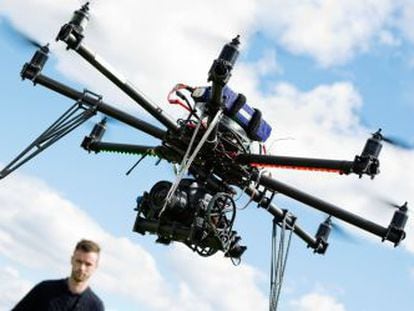 A technician flying a drone.