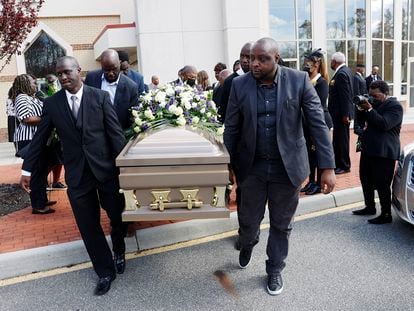 The casket of Irvo Otieno is carried out of First Baptist Church of South Richmond in North Chesterfield, Virginia, on March 29, 2023.