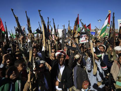 Houthi supporters shout slogans while holding up weapons during a protest against the US and Israel and in support of Palestinians, in Sana'a, Yemen, 23 February 2024.