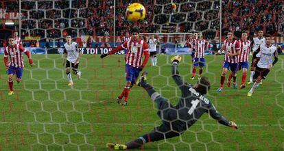 Atl&eacute;tico Madrid&#039;s Diego Costa beats Valencia&#039;s Diego Alves after the goalkeeper had saved another penalty taken by the same player.
