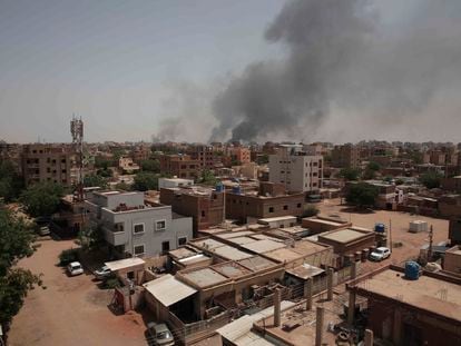 Smoke rises from a central neighborhood of Khartoum, Sudan, Sunday, April 16, 2023, after dozens have been killed in two days of intense fighting.