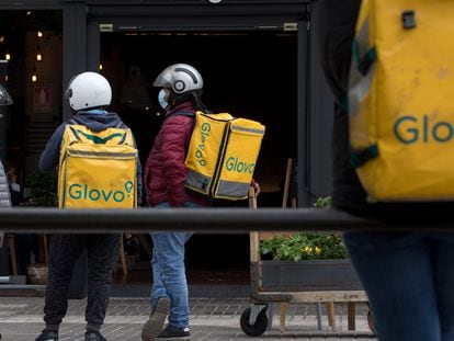 Glovo food delivery riders in Madrid.